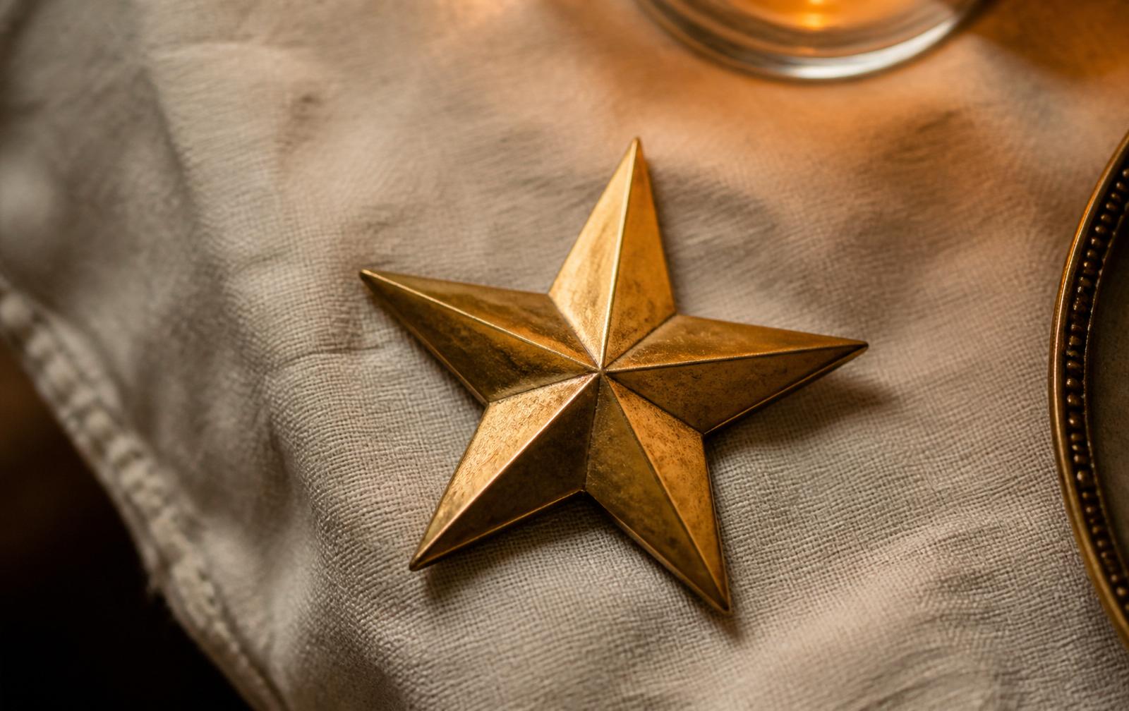 Aged brass five-point star on ivory linen